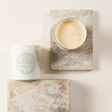 WeKind White Jasmine Candle arranged on some natural stone